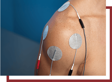 Electric stimulation therapy patches applied to a man's shoulder
