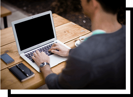 Man with good posture using a laptop