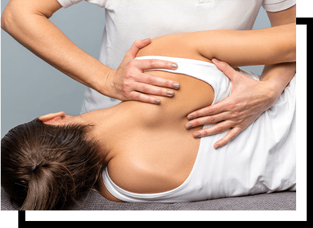 A chiropractor adjusting a woman's back