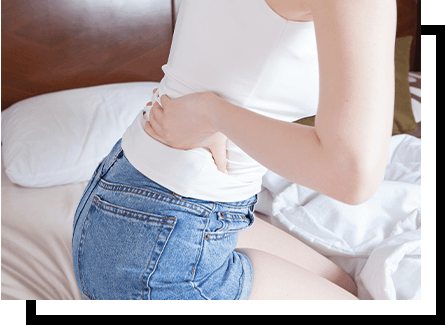 Woman pressing her hand on her lower back
